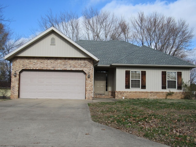 ranch-style house featuring a garage