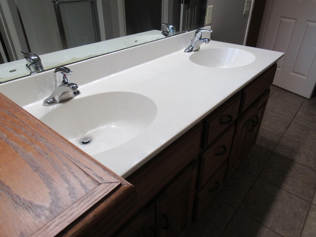 bathroom with tile patterned flooring and vanity