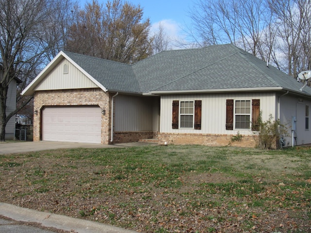 single story home featuring a front lawn and a garage