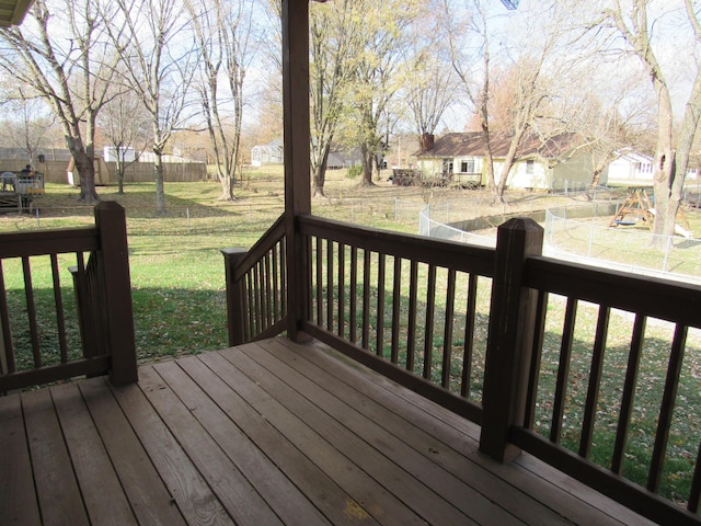 wooden terrace with a yard