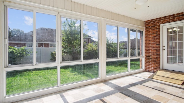 unfurnished sunroom with a healthy amount of sunlight