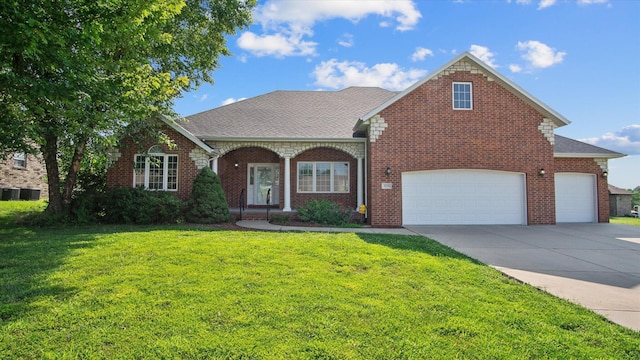 front facade featuring a front yard and a garage