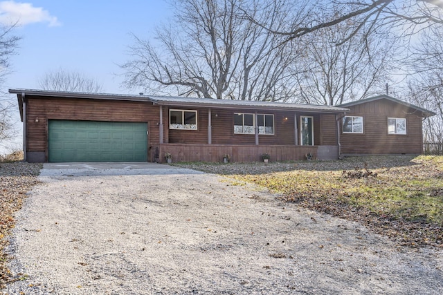 ranch-style home featuring a garage