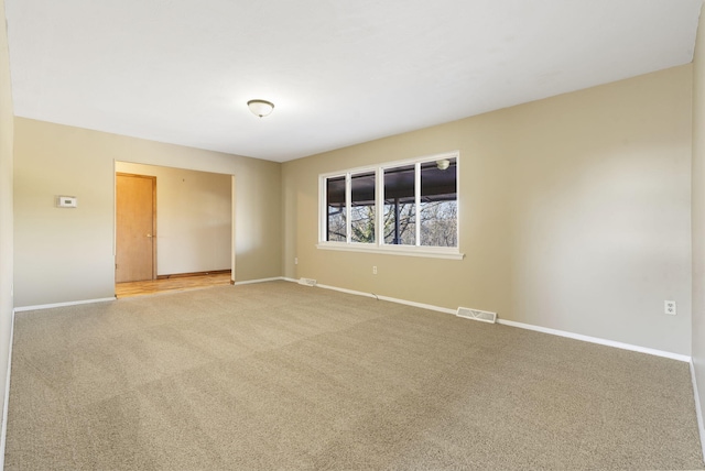 unfurnished room with carpet