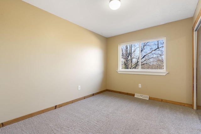 spare room featuring carpet floors