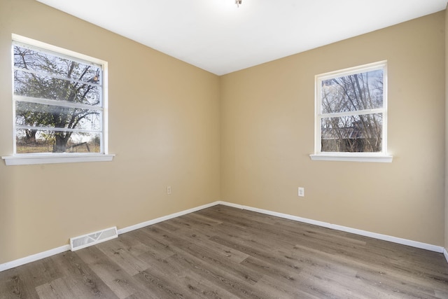 empty room with wood-type flooring