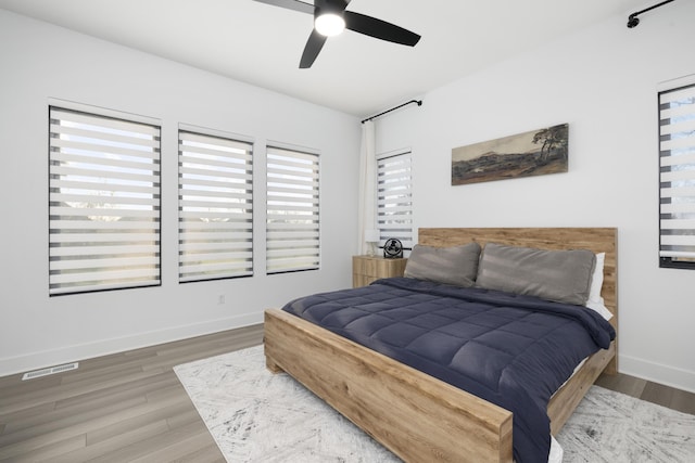 bedroom featuring ceiling fan and hardwood / wood-style flooring