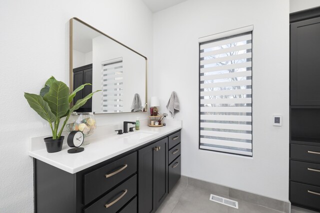 interior space featuring light tile patterned floors and sink