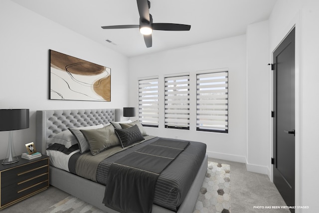 carpeted bedroom featuring ceiling fan