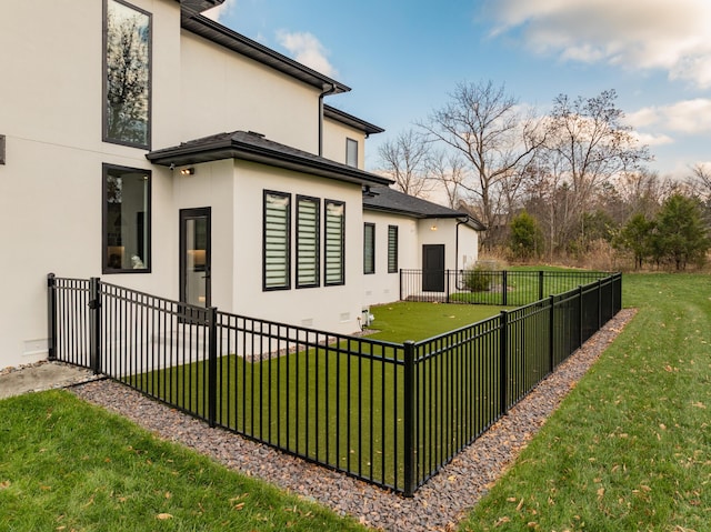 view of side of home featuring a yard