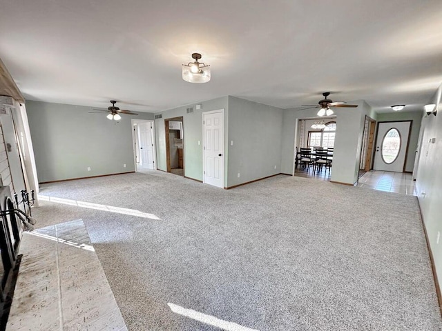 unfurnished living room with ceiling fan and light colored carpet