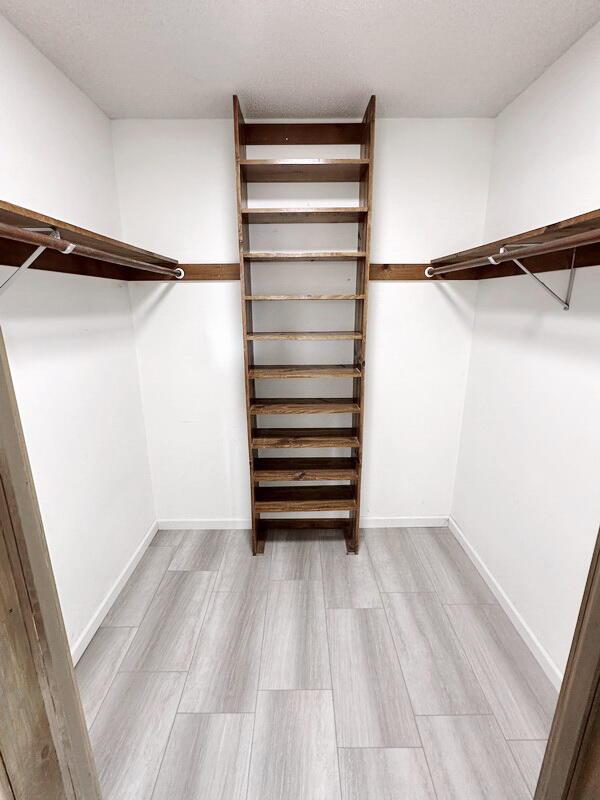 walk in closet featuring light wood-type flooring