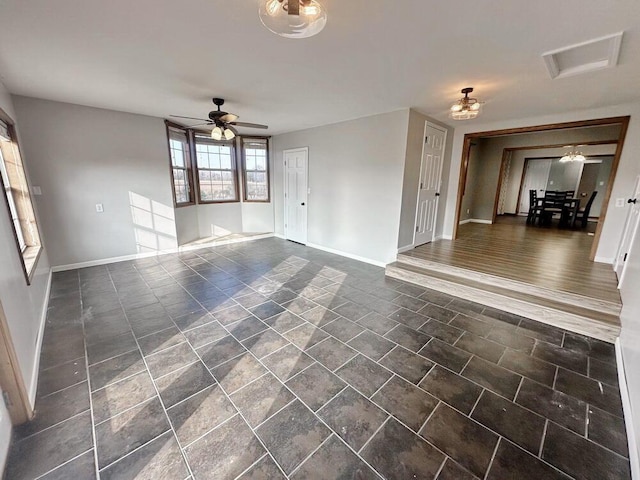 unfurnished living room featuring ceiling fan