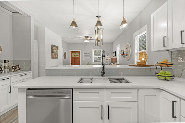 kitchen with dishwasher, sink, ceiling fan, tasteful backsplash, and white cabinetry