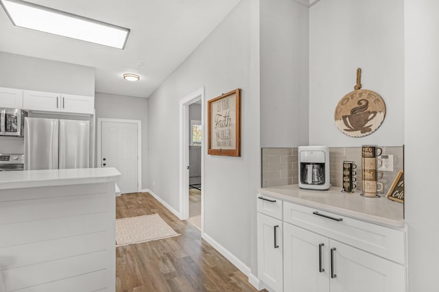 hallway featuring hardwood / wood-style floors