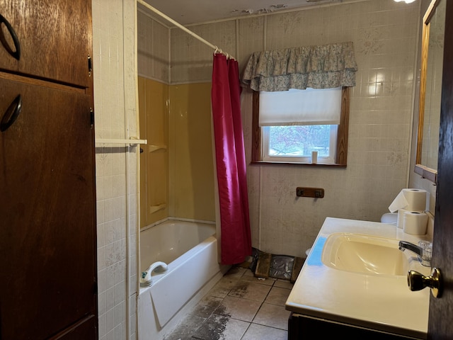 bathroom featuring vanity, tile patterned floors, tile walls, and shower / bath combo with shower curtain