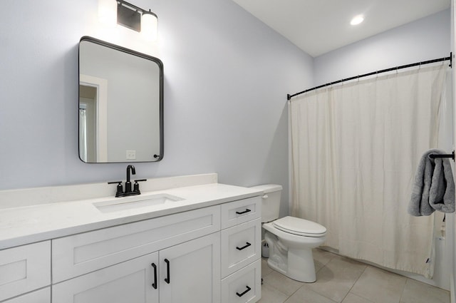 bathroom featuring toilet, vanity, tile patterned floors, and walk in shower