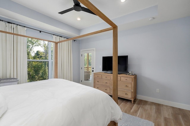 bedroom featuring light wood-type flooring, access to outside, and ceiling fan