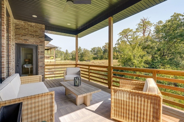 wooden terrace featuring ceiling fan