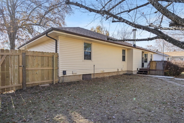 view of side of home with a deck