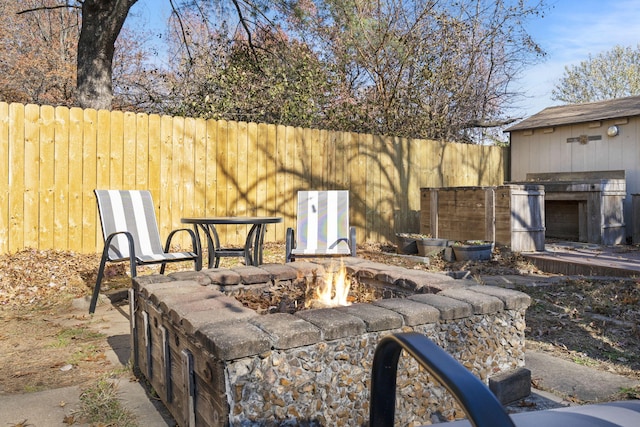 view of patio with an outdoor fire pit