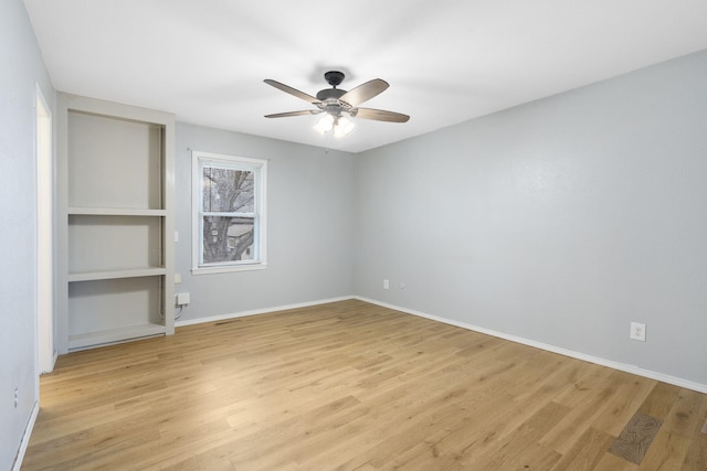 unfurnished room featuring ceiling fan and light hardwood / wood-style flooring