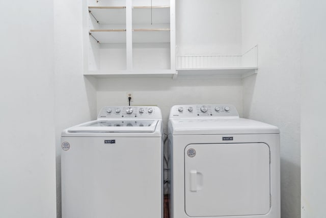 laundry area with washing machine and dryer