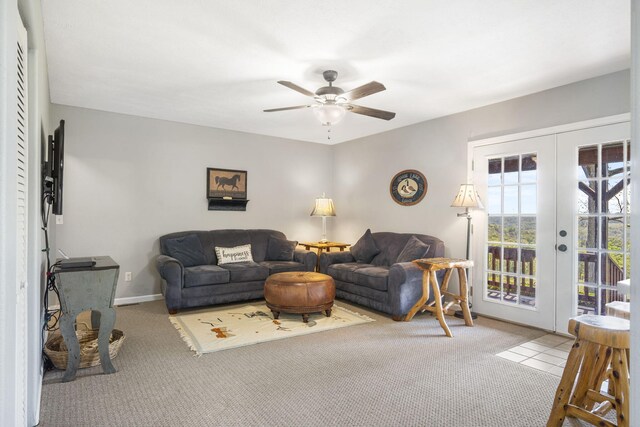 carpeted living room featuring ceiling fan and french doors