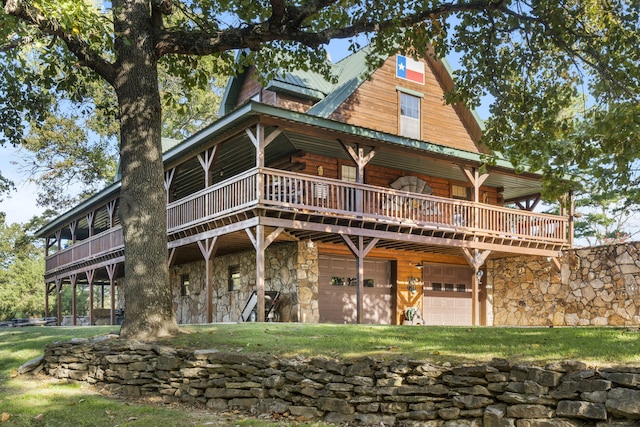 view of front of property with a wooden deck and a garage