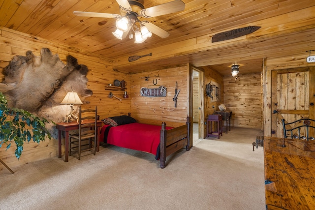 carpeted bedroom with wood ceiling and wooden walls