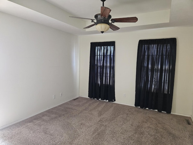 empty room featuring carpet flooring and ceiling fan