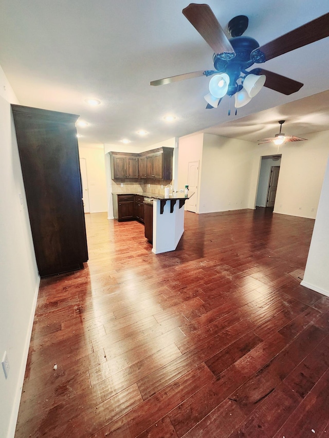 unfurnished living room with wood-type flooring