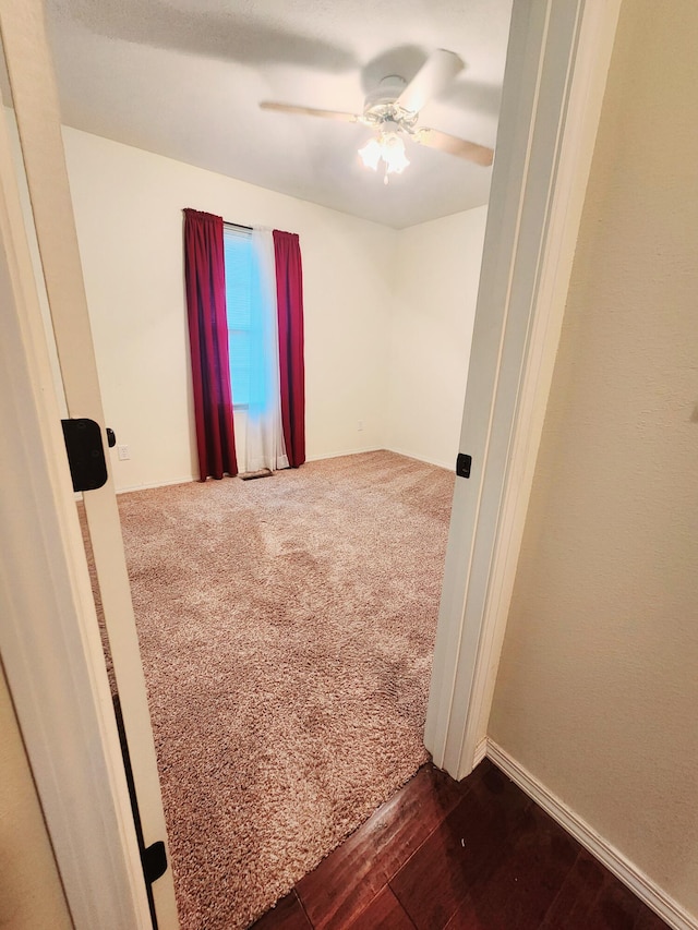 unfurnished room with hardwood / wood-style flooring and ceiling fan