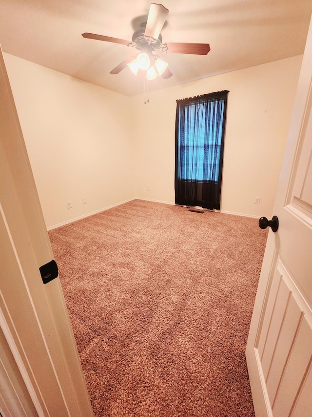 carpeted empty room with ceiling fan