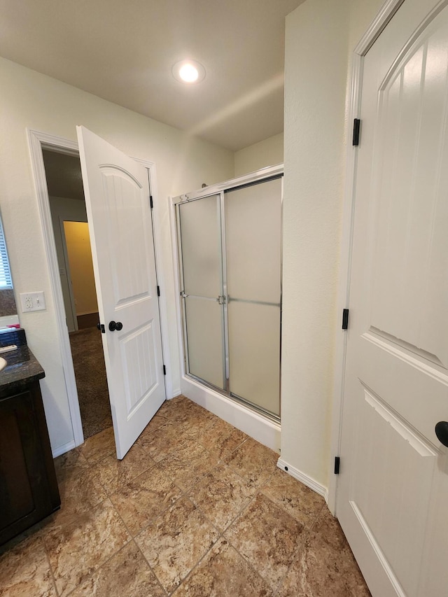 bathroom with vanity and walk in shower