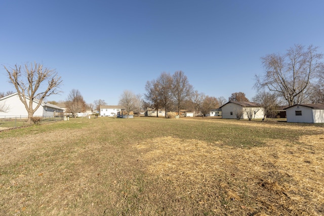 view of yard featuring a storage unit