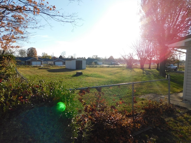 view of yard with a storage unit