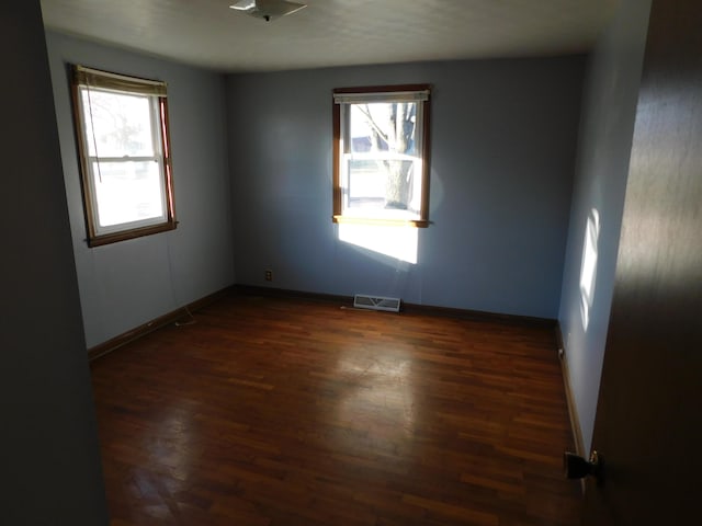 empty room featuring dark hardwood / wood-style floors