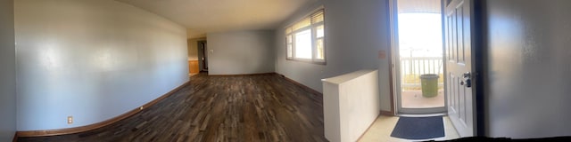 hallway with hardwood / wood-style floors