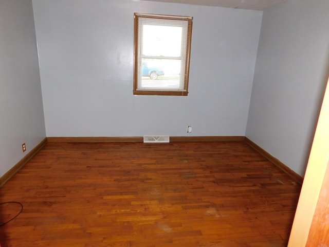 empty room featuring dark hardwood / wood-style floors