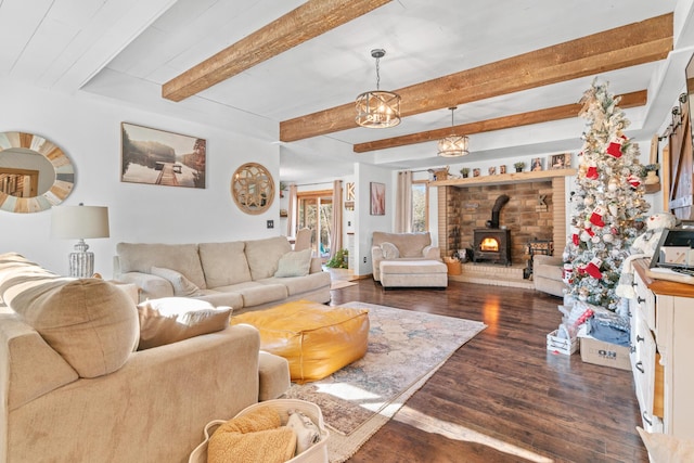 living room featuring beamed ceiling, dark hardwood / wood-style floors, and a wood stove