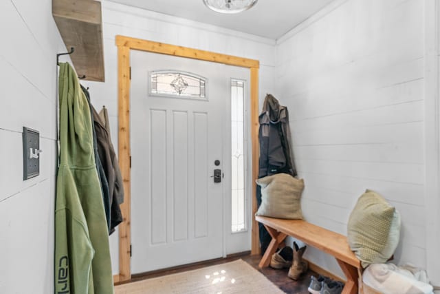 entrance foyer featuring wooden walls