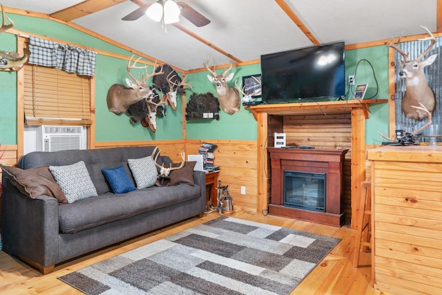 living room with wood-type flooring, cooling unit, lofted ceiling, and ceiling fan