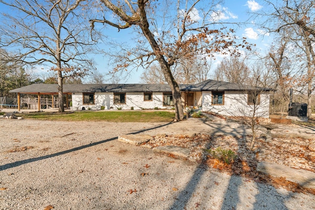 view of front facade featuring a front yard and a trampoline