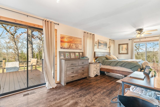 bedroom with access to exterior, dark hardwood / wood-style flooring, and ceiling fan