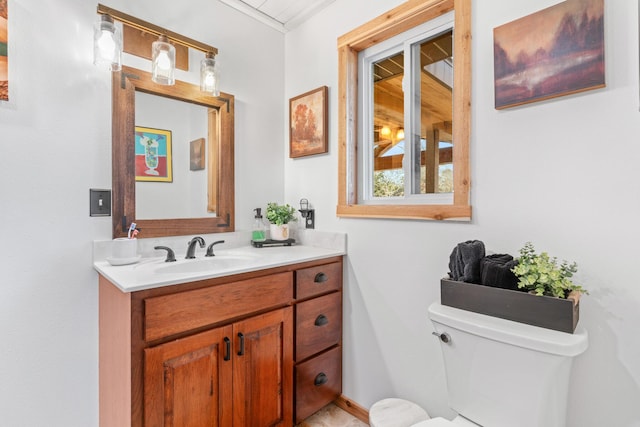 bathroom with vanity and toilet