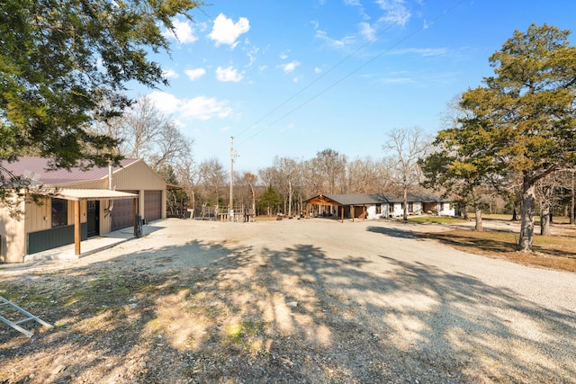 view of yard featuring an outbuilding and a garage