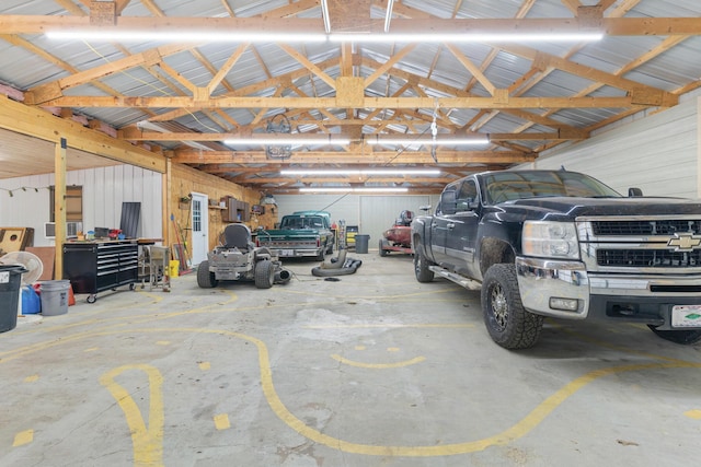 garage featuring wood walls