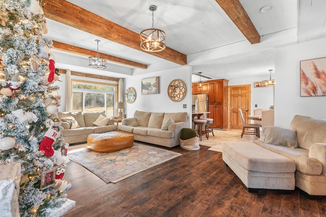 living room with beamed ceiling, a chandelier, and dark hardwood / wood-style floors