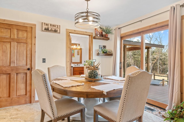 dining area with a chandelier